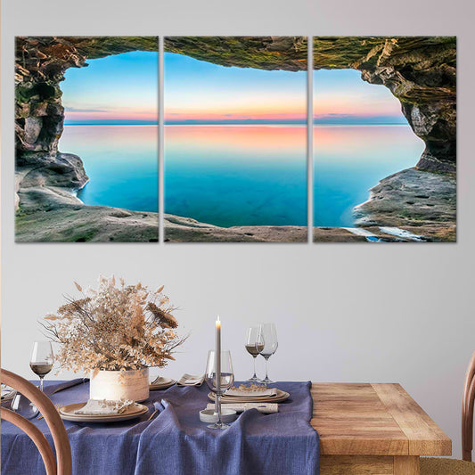  Extra large ocean wall art showcasing a stunning cave view overlooking the calm blue sea at dusk.