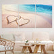 Extra large ocean wall art with romantic hearts etched in the sand, creating a serene and loving ambiance.