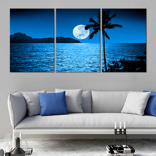 Tropical canvas wall art depicting a silhouetted palm tree against moonlit waters.