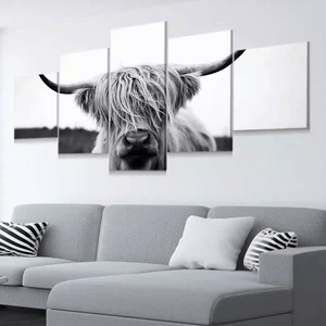 Living room mockup showing Highland cow canvas wall art in 5-panel format for XL walls