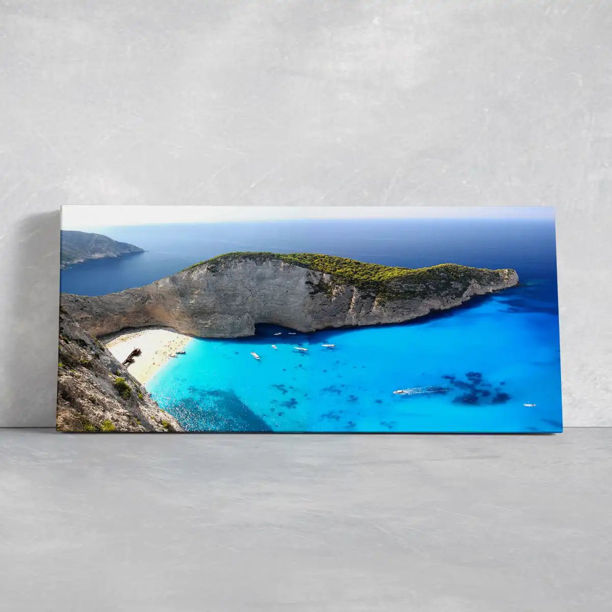  Large canvas beach wall art of a breathtaking aerial view of a secluded beach surrounded by stunning cliffs.