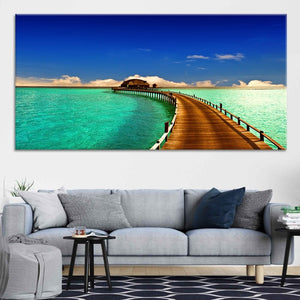 Large canvas beach wall art depicting a peaceful Maldives overwater resort with crystal-clear waters.