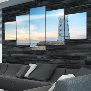 Large framed coastal wall art with a vibrant sky and lighthouse beacon.