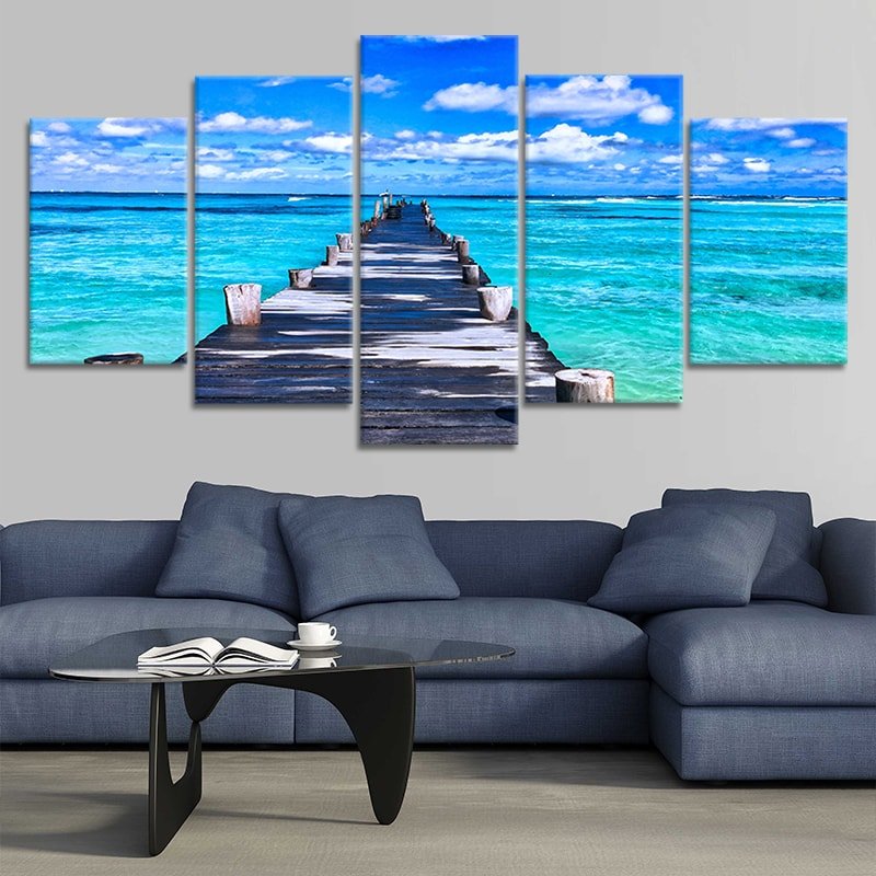 Ocean beach artwork with a rustic wooden pier leading into the sea.