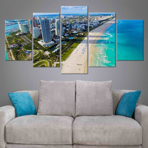 Coastal artwork featuring an aerial view of Miami’s white sandy beaches.