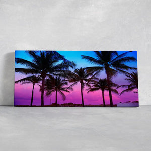 Large horizontal wall art highlighting palm trees swaying in the evening breeze.