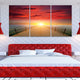 Coastal wall art for bedroom with a vibrant sunset over calm ocean waters.