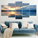 Ocean wall art canvas featuring a golden sunset and deep blue sky contrast.