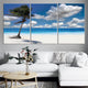 Nautical wall art showcasing a sunny beach and swaying palm tree.