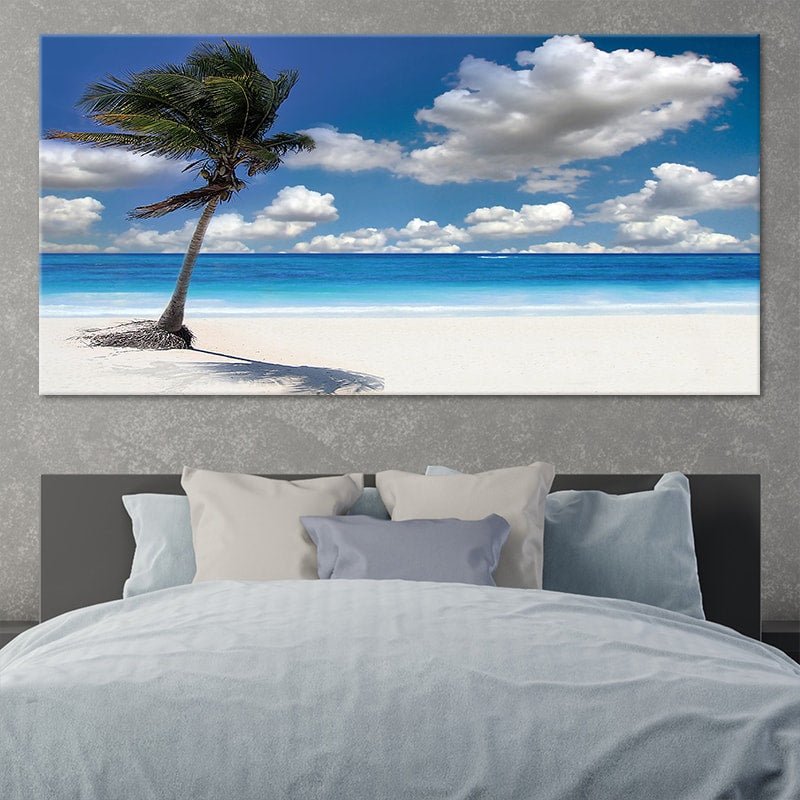 Coastal canvas prints of a tropical beach with a leaning palm tree.