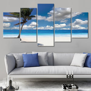 Coastal farmhouse wall art with a palm tree and deep blue ocean.