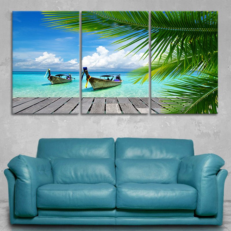 Tropical ocean wall art with vivid blue skies and palm leaves, bringing tropical vibes.