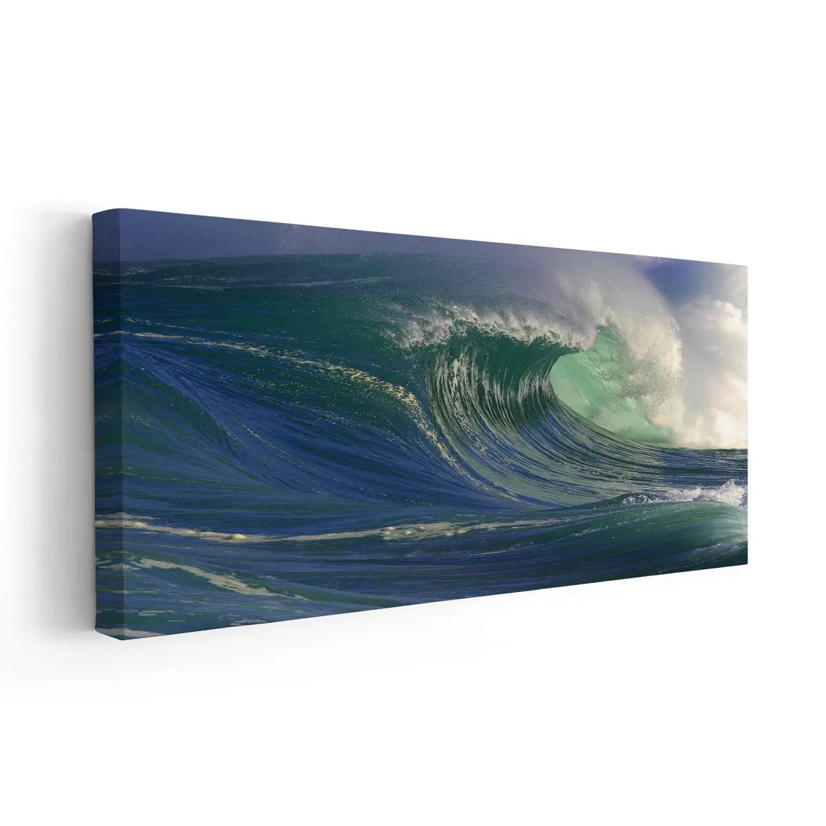 Ocean canvas prints of a tropical wave crashing under a blue sky.